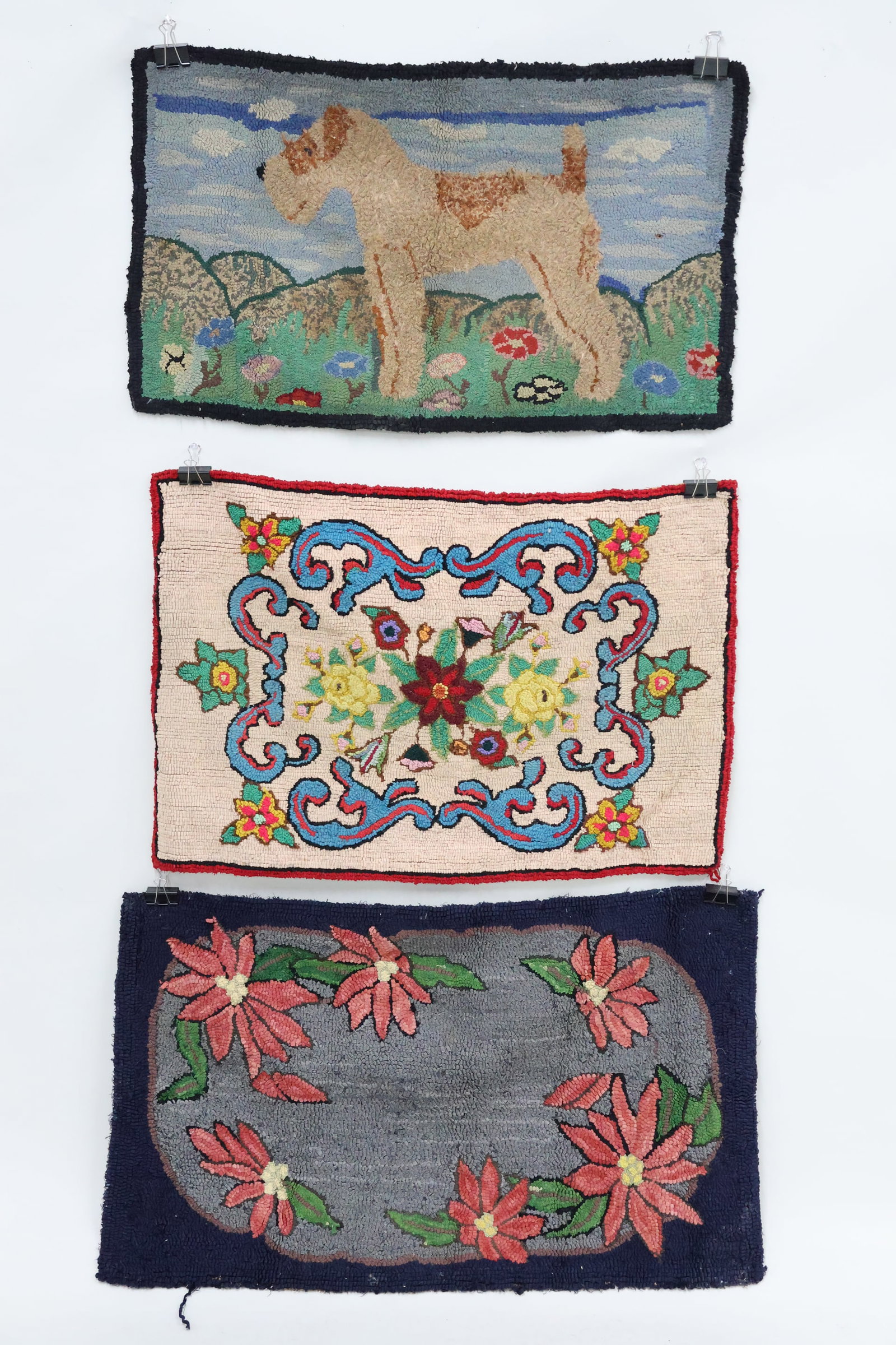Vintage Folk Art Hooked Rug of Terrier: Vintage Folk Art Hooked Rug of Terrier Vintage Folk Art Hooked Rug of Terrier 21 1/2" x 36 1/2". Together with two floral decorated hooked rugs, one measures 24 1/2" x 40 1/2", the other with red