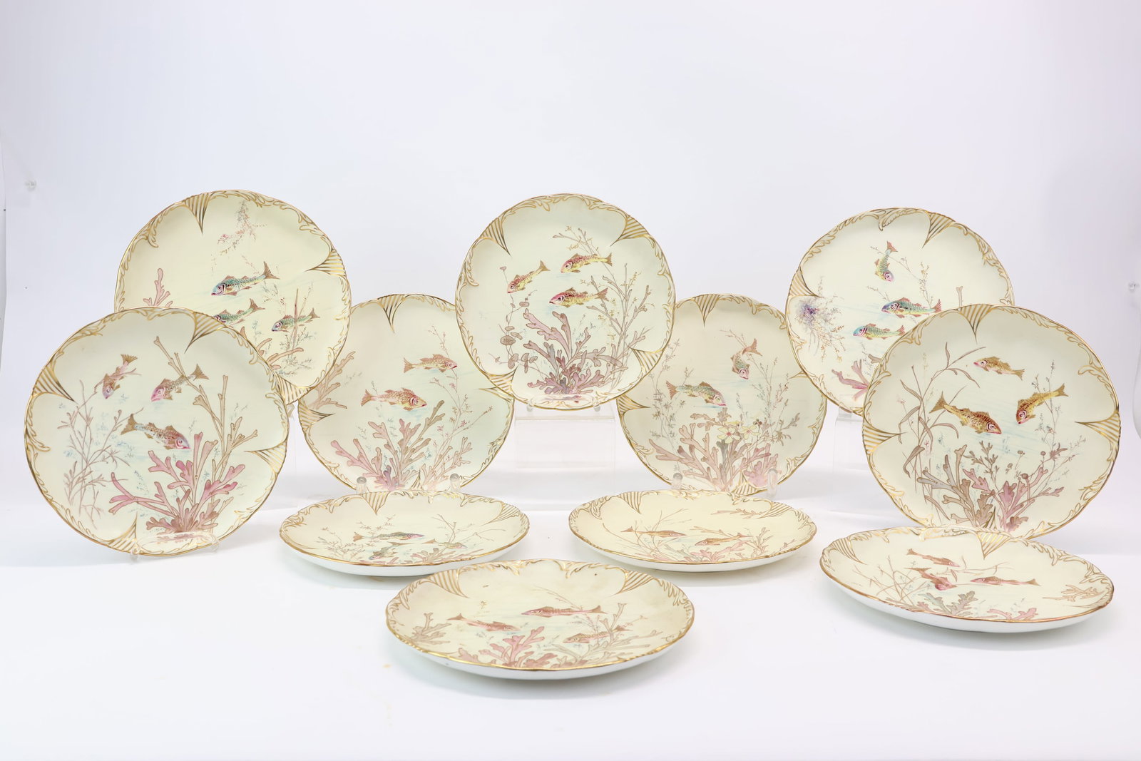 Set of Eleven Pointons England Gilt Fish Decorated Plates: Set of Eleven Pointons England Gilt Fish Decorated Plates Set of Eleven Pointons England Gilt Fish Decorated Plates. Used condition, some wear8 1/2" diameter