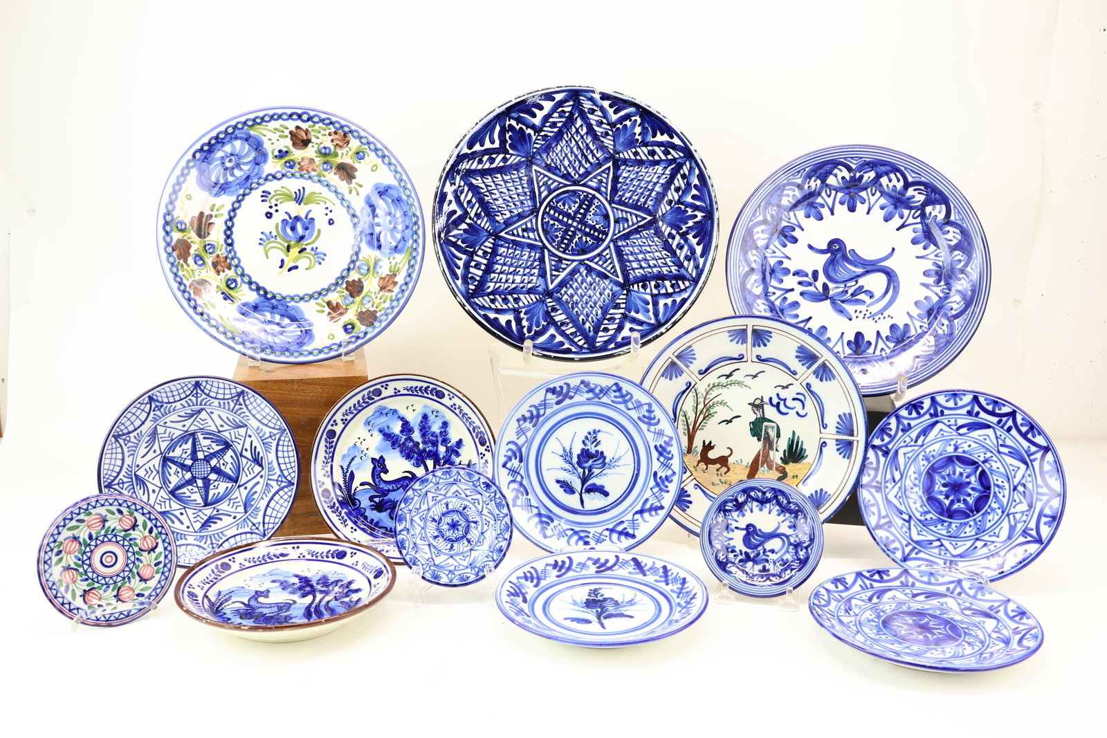 Group of Vintage Spanish Hand Painted Blue and White Decorative Plates: Group of Vintage Spanish Hand Painted Blue and White Decorative Plates Group of Vintage Spanish Hand Painted Blue and White Decorative Plates. Including some with floral decorations, dog motif, bird