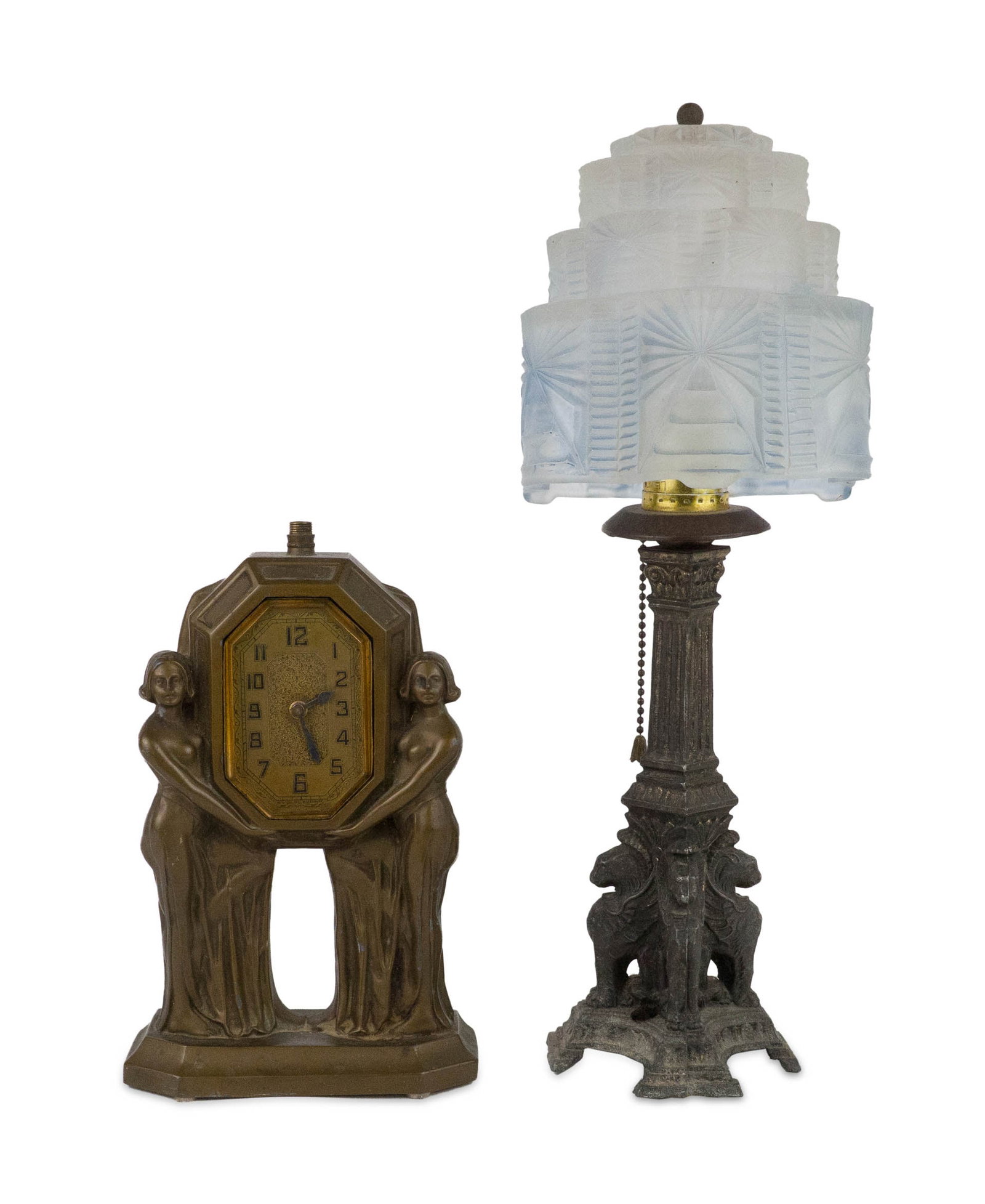 Art Deco Figural Clock: Art Deco Figural Clock 20th C. Together with an Art Deco table lamp with stepped glass shade. Losses, wear, surface distress. 9 1/4 x 5 3/4 x 2 1/2 in. (23.5 x 14.6 x 6.4 cm.), and 15 1/2 x 6 in. (39.