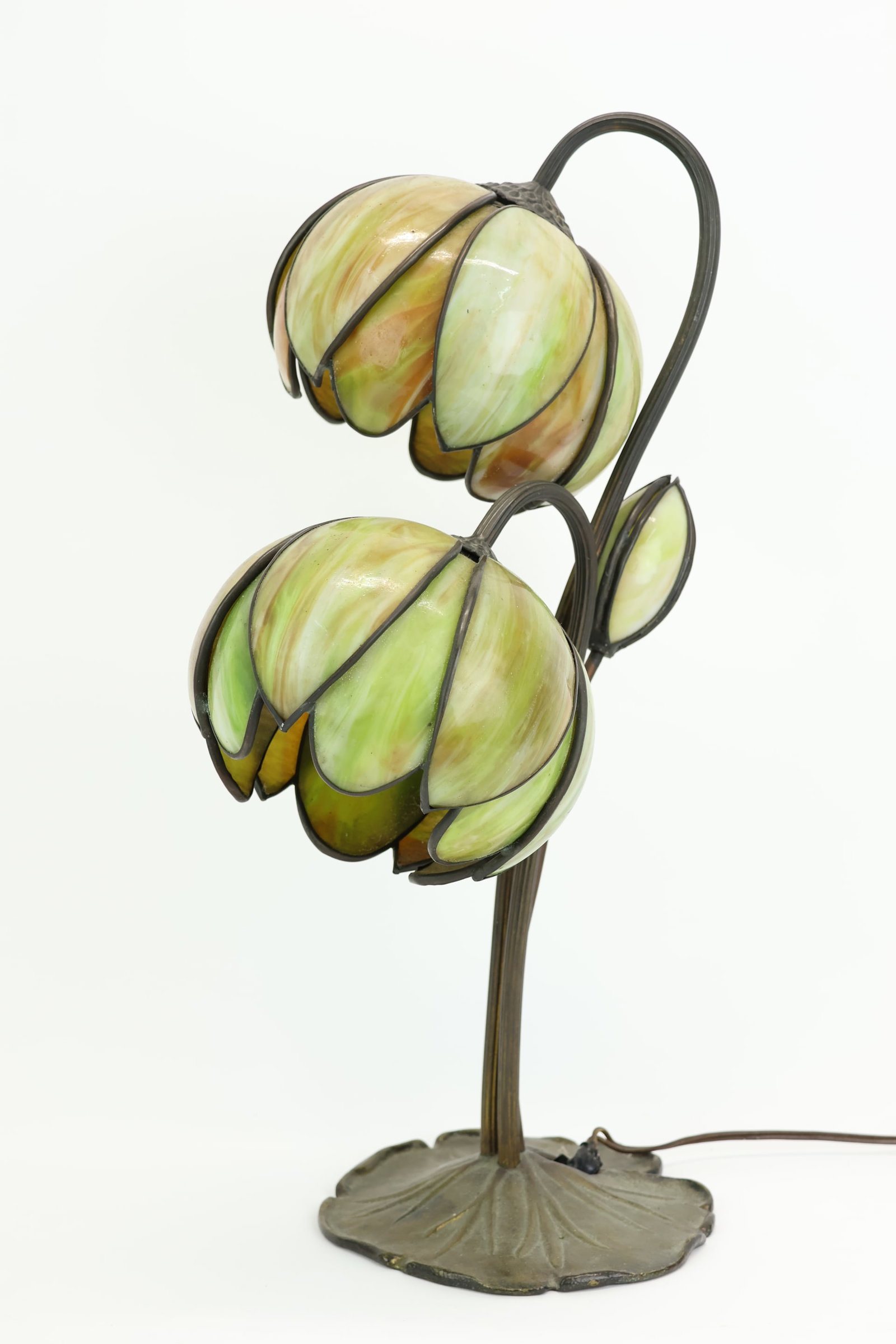 Art Nouveau Water Lily 2-Light Slag Glass & Bronze Table Lamp: Art Nouveau Water Lily 2-Light Slag Glass & Bronze Table Lamp Art Nouveau Water Lily 2-Light Slag Glass & Patinated Bronze Table Lamp, having a lily pad base with three stems with green and caramel sl
