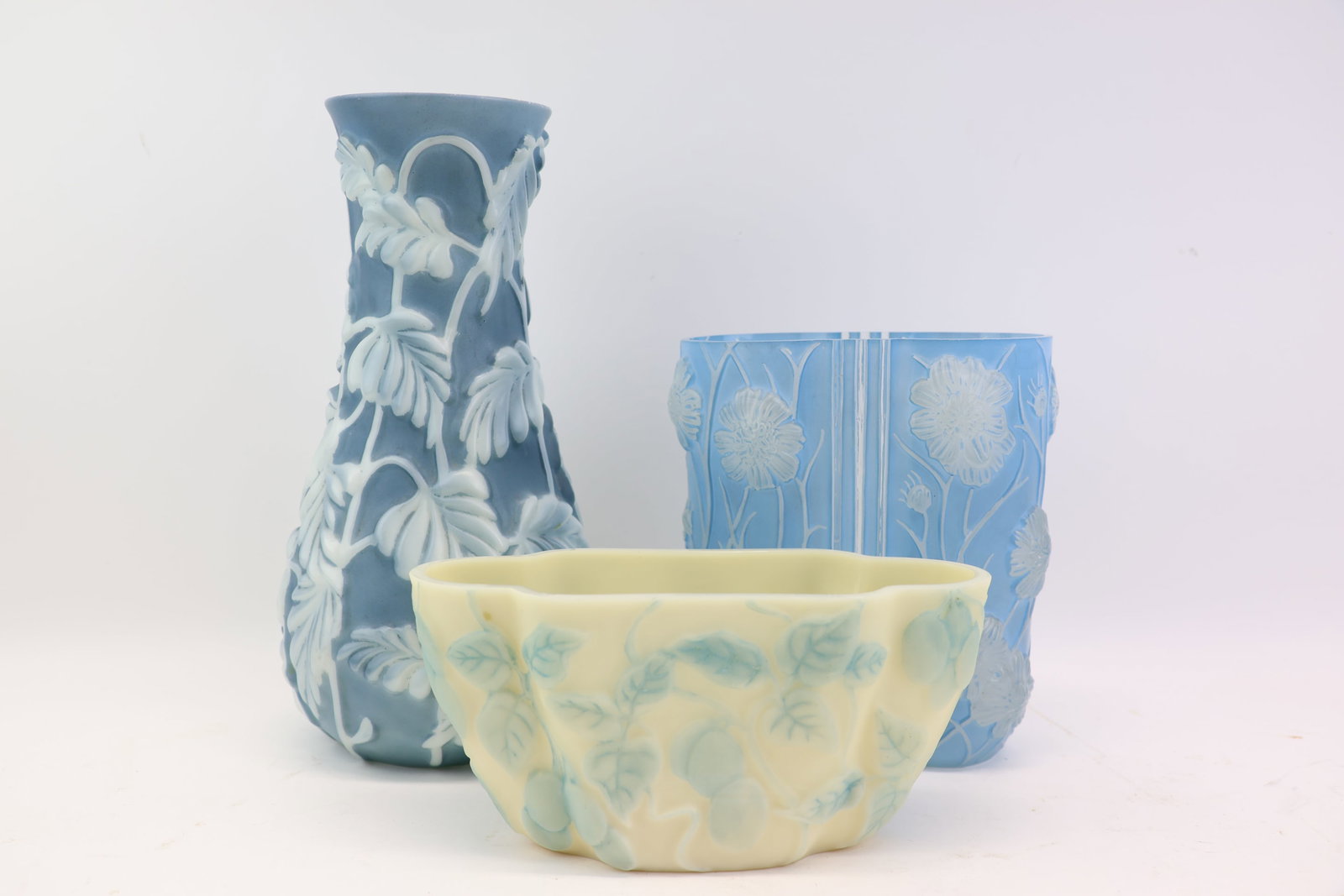 Two Phoenix Glass Company Vases: Two Phoenix Glass Company Vases Two Phoenix Glass Company Vases, one tall with blue ground, milky white philodendron, the other a shorter style with light blue ground and floral poppy design; used