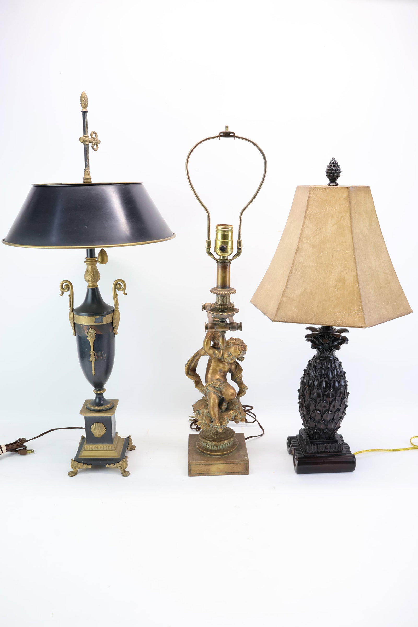 Group of Three Assorted Table Lamps: Group of Three Assorted Table Lamps Group of Three Assorted Table Lamps. Comprising, a gold painted figural lamp, a painted tole lamp, and a pineapple form lamp. Losses to paint, used condition, wear,