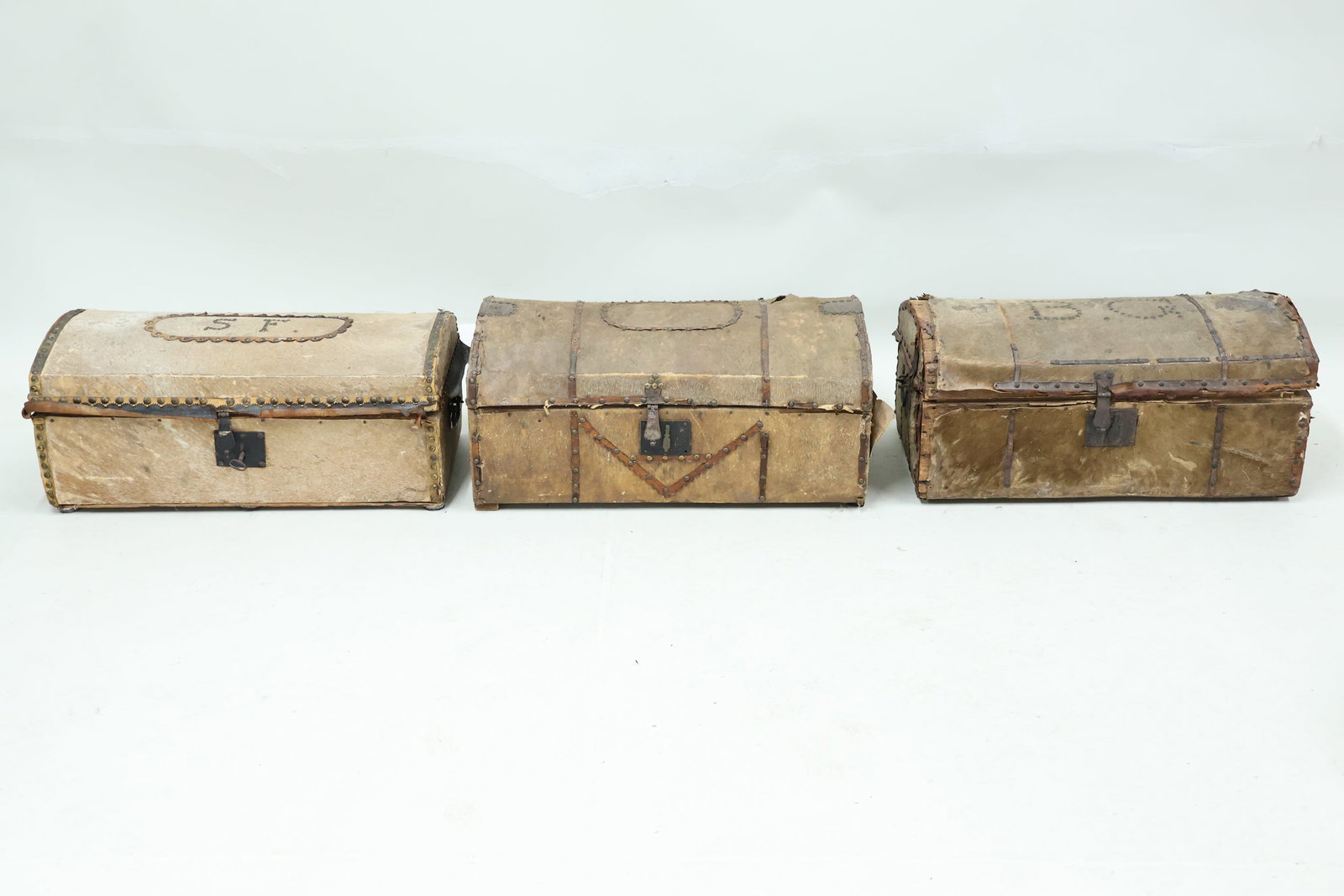 Three Antique Cowhide Dometop Trunks with Decorative Tacks (1 of 14)