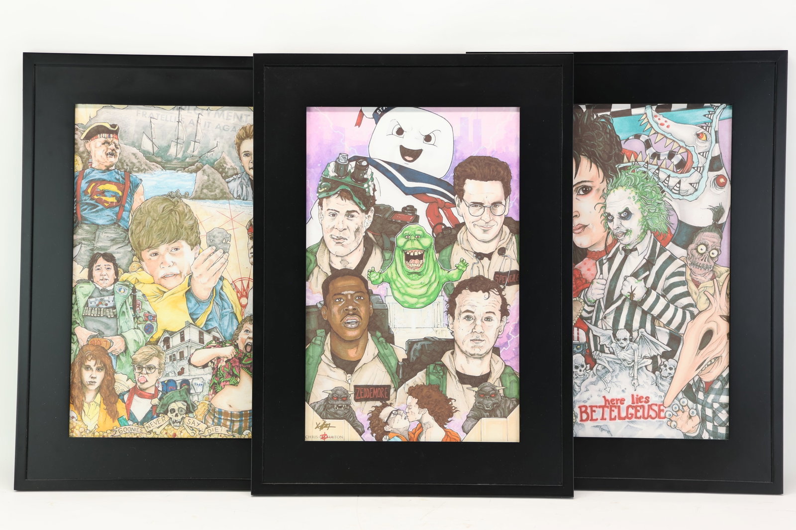Set of 3 Chris Oz Fulton 1980s Framed Movie Prints: Set of 3 Chris Oz Fulton 1980s Framed Movie Prints Set of 3 Chris Oz Fulton 1980s Framed Movie Prints, in matching modern black frames, one featuring themes from Goonies, one featuring Beetlejuice,