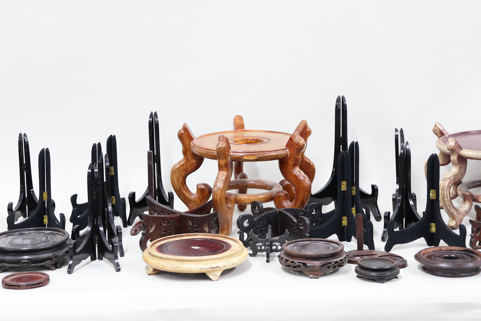 Group of Assorted Hardwood Stands: Group of Assorted Hardwood Stands Group of Assorted Hardwood Stands. Together with an assortment of plate stands. Used condition, wear, worn, losses