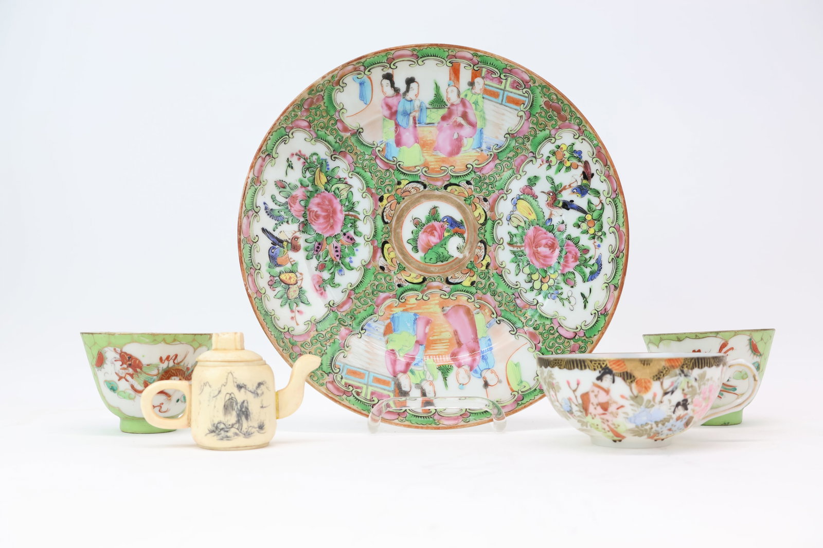 Group of Assorted Asian Table Articles: Group of Assorted Asian Table Articles Group of Assorted Asian Table Articles. Comprising of a Rose Medallion 8 1/2" Plate, carved bone tea pot, pair of dragon and phoenix decorated cups and a