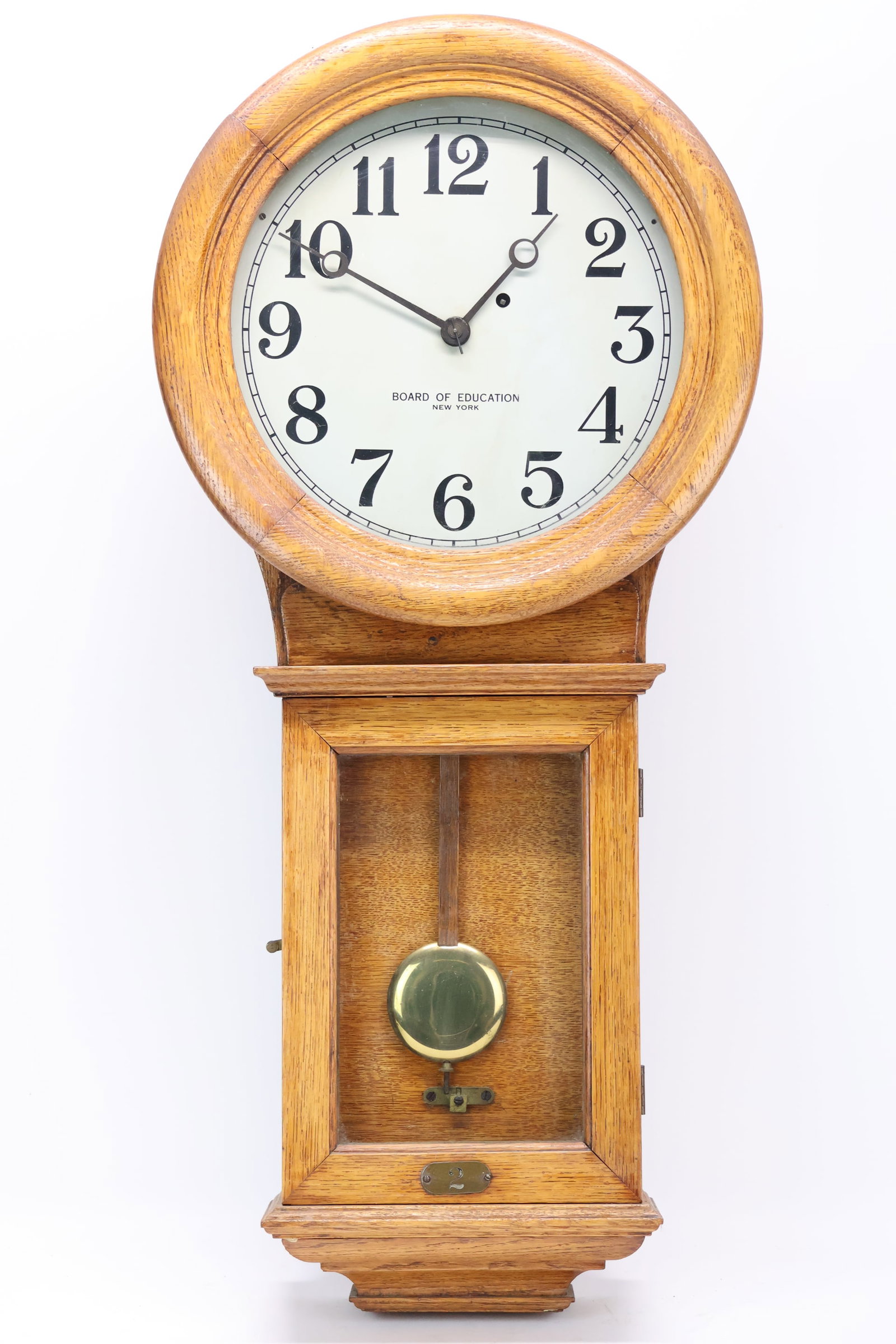 Antique New York Board of Education Oak Wall Clock: Antique New York Board of Education Oak Wall Clock Antique Board of Education New York Oak Wall Clock. Used unknown working condition. 33 1/2" tall x 16" x 5 1/4"