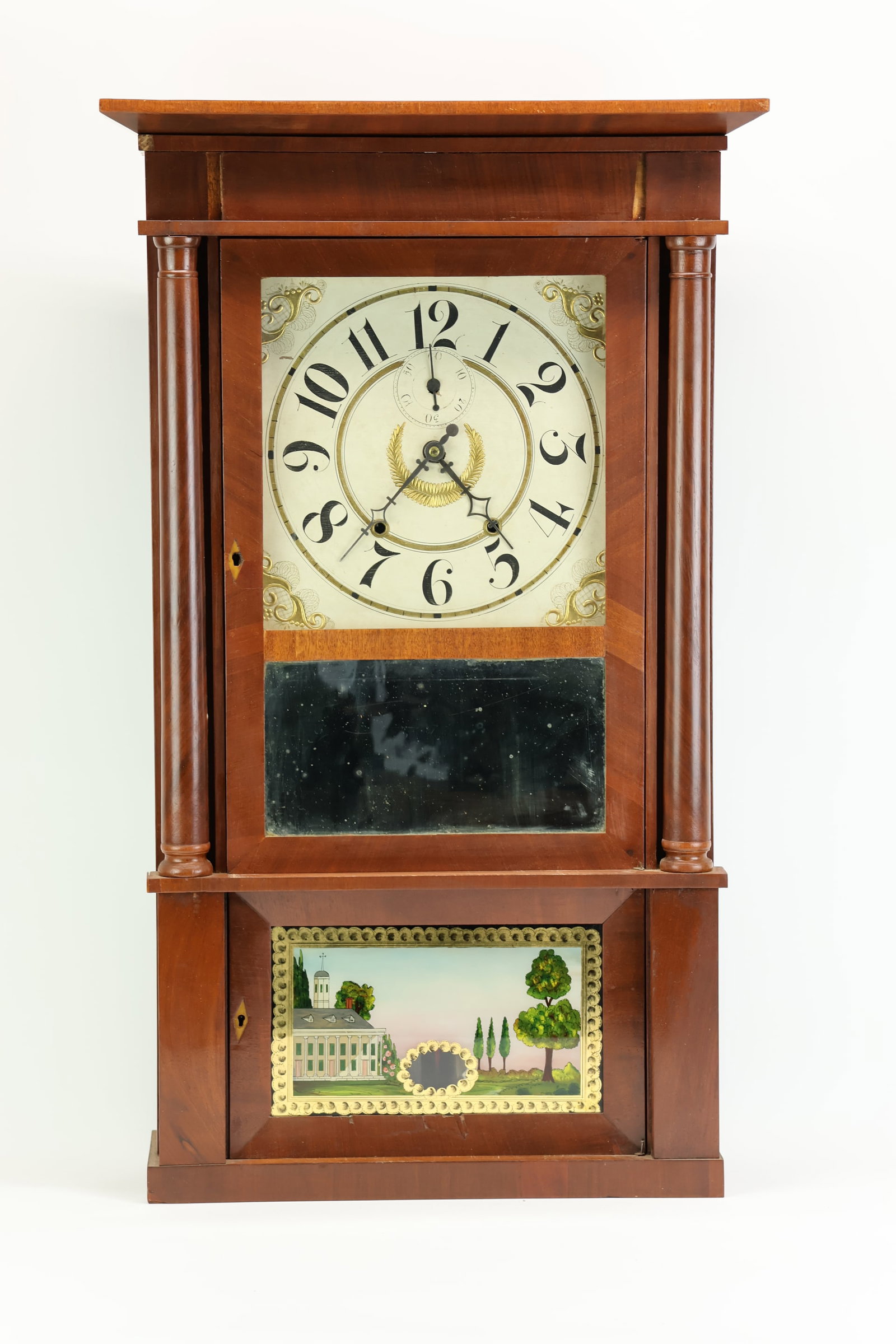 Riley Whiting 8 Day Shelf Clock: Riley Whiting 8 Day Shelf Clock Riley Whiting 8 Day Shelf Clock, in a mahogany pillar case, with central mirror above eglomise panel, having weights; Used unknown working condition, wear, worn; 33