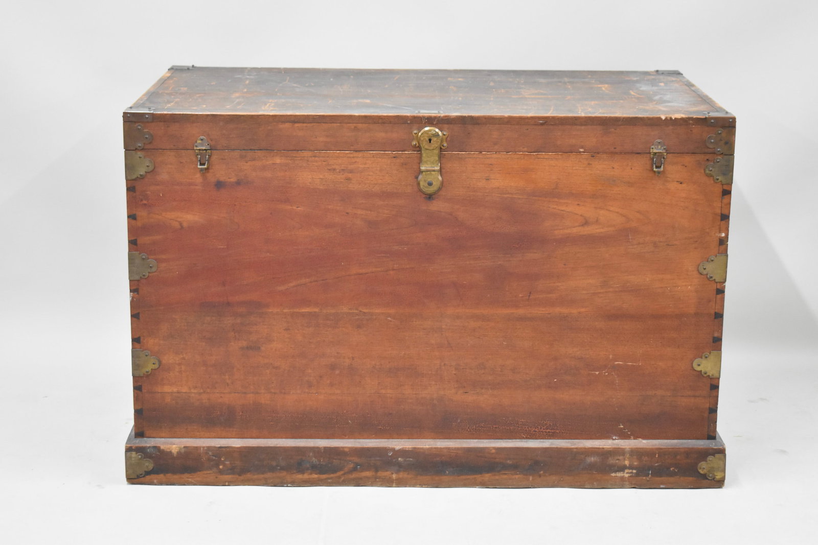 Large Wooden Brass Bound and Dovetailed Storage Chest: Large Wooden Brass Bound and Dovetailed Storage Chest Large Wooden Brass Bound and Dovetailed Storage Chest. Used condition, wear, worn. 34 1/4"h x 55"w x 32"d
