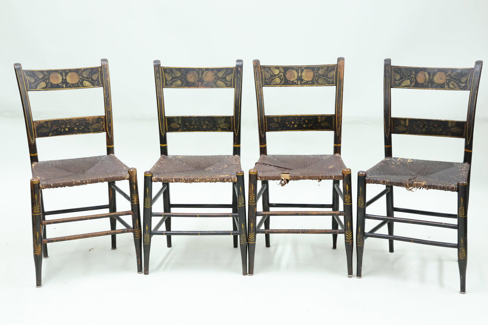 Set of Four Antique Stencil Decorated Hitchcock Side Chairs: Set of Four Antique Stencil Decorated Hitchcock Side Chairs Set of Four Antique Stencil Decorated Side Chairs, each with woven rush seat. Used condition, wear, worn, losses. 33 1/4"h x 16 1/2"w x