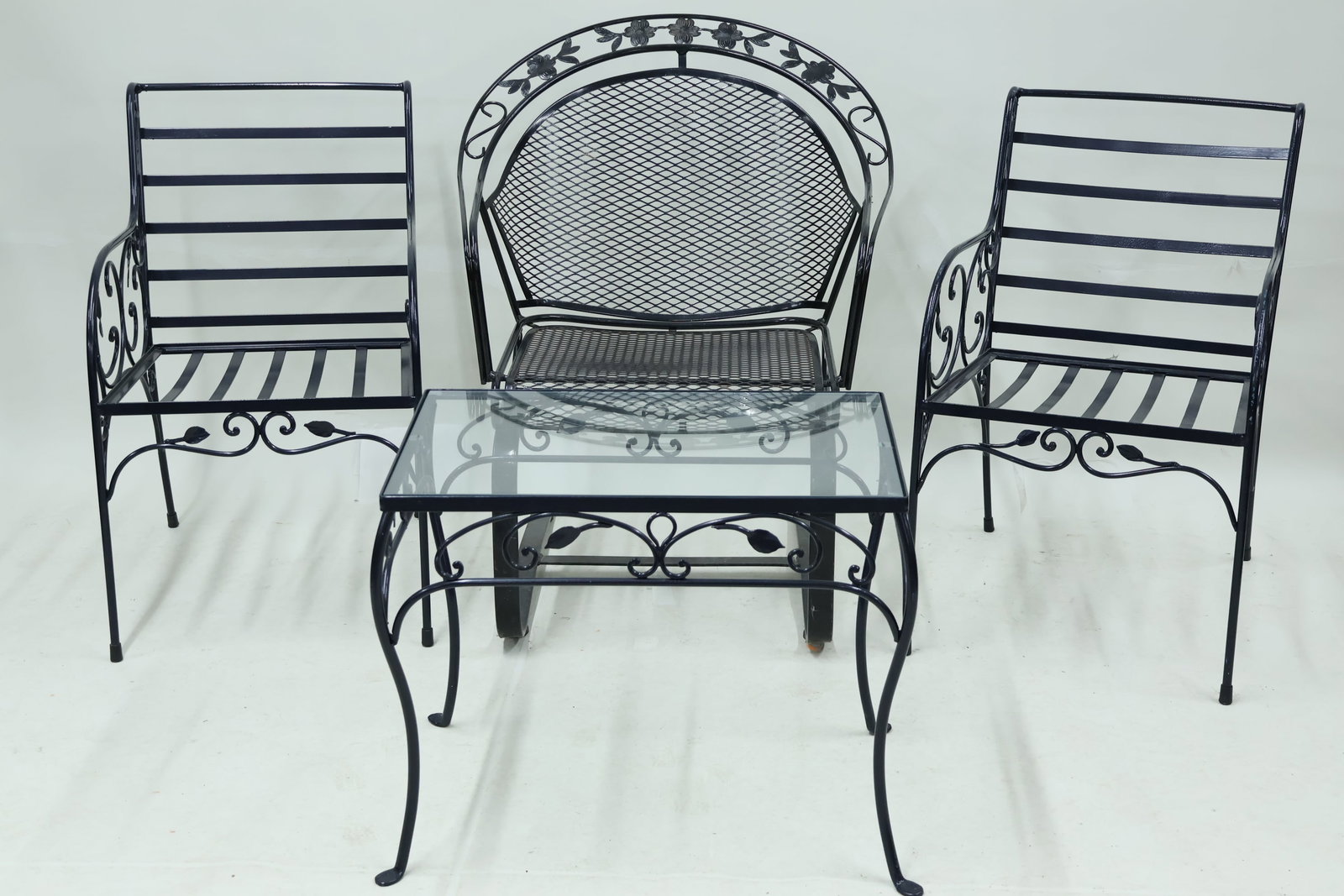 Pair of Iron Scrollwork Decorated Armchairs: Pair of Iron Scrollwork Decorated Armchairs Pair of Iron Scrollwork and Floral Decorated Armchairs. Together with a matching glass top side table and a iron floral decorated spring chair. Used conditi