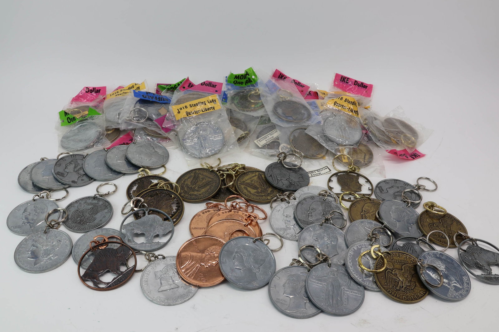 Group of 90 Assorted Faux 3 inch Metal Coin Key Chains: Group of 90 Assorted Faux 3 inch Metal Coin Key Chains Group of 90 Assorted Faux 3 inch Metal Coin Key Chains. Used condition, wear, worn, losses