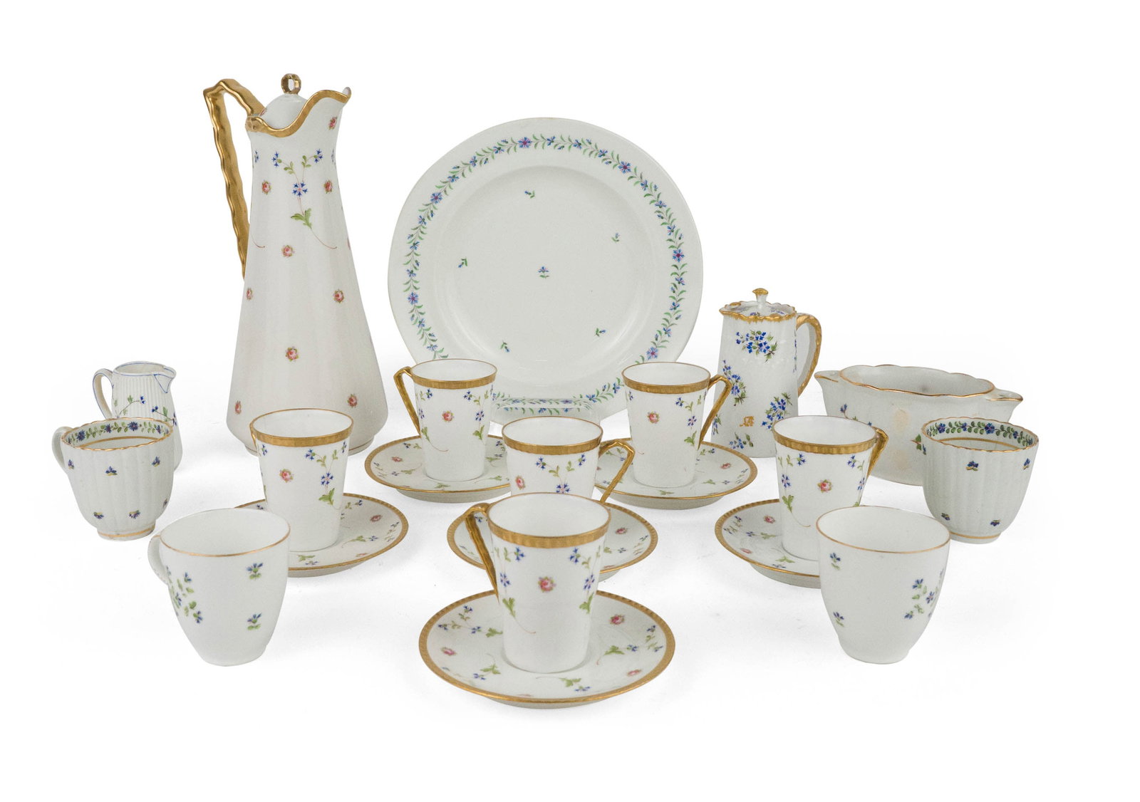 Limoges Floral Decorated Teacups and Saucers: Limoges Floral Decorated Teacups and Saucers Together with a matching covered coffee pot, four similar teacups, a sauceboat, two creamers, and a Royal Vienna plate. 21 pieces Stains, wear, surface