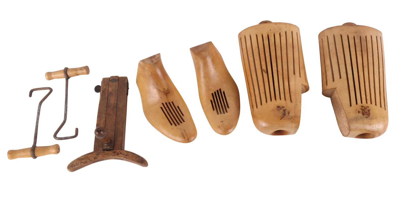 19th C. Top Hat Maker's Cutting Guide: 19th C. Top Hat Maker's Cutting Guide C. 1830, to measure to cut a brim. Together with a pair of maple ventilated bootjacks, size 9.5 and two bootstrap pullers. 5 pieces Some surface distress.