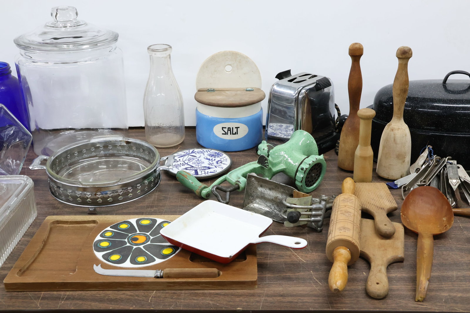 Large Group of Assorted Kitchen Articles: Large Group of Assorted Kitchen Articles Large Group of Assorted Kitchen Articles. Including and enameled hand grinder, salt crock, covered jars, Gorden's milk bottle, collection of can openers, vinta