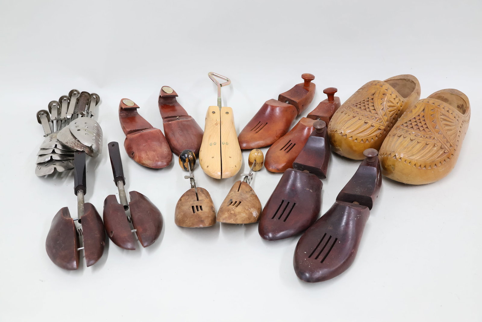 Vintage Pair of Folk Carved Wooden Clogs: Vintage Pair of Folk Carved Wooden Clogs Vintage Pair of Folk Carved Wooden Clogs. Together with a group of assorted shoes stretchers. Used condition, wear, worn, losses. One clog measures 13" long x