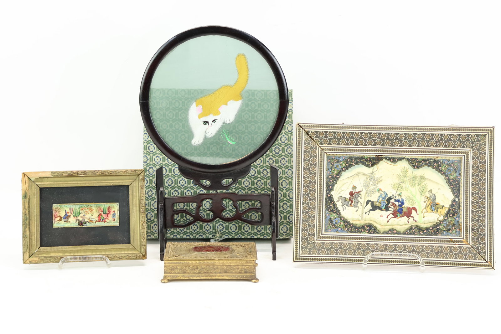 Two Vintage Miniature Persian Paintings: Two Vintage Miniature Persian Paintings Two Vintage Miniature Persian Paintings. The smaller painting on a panel is of a hunting scene and the larger on a panel of a polo scene is in a Khatamkari micr