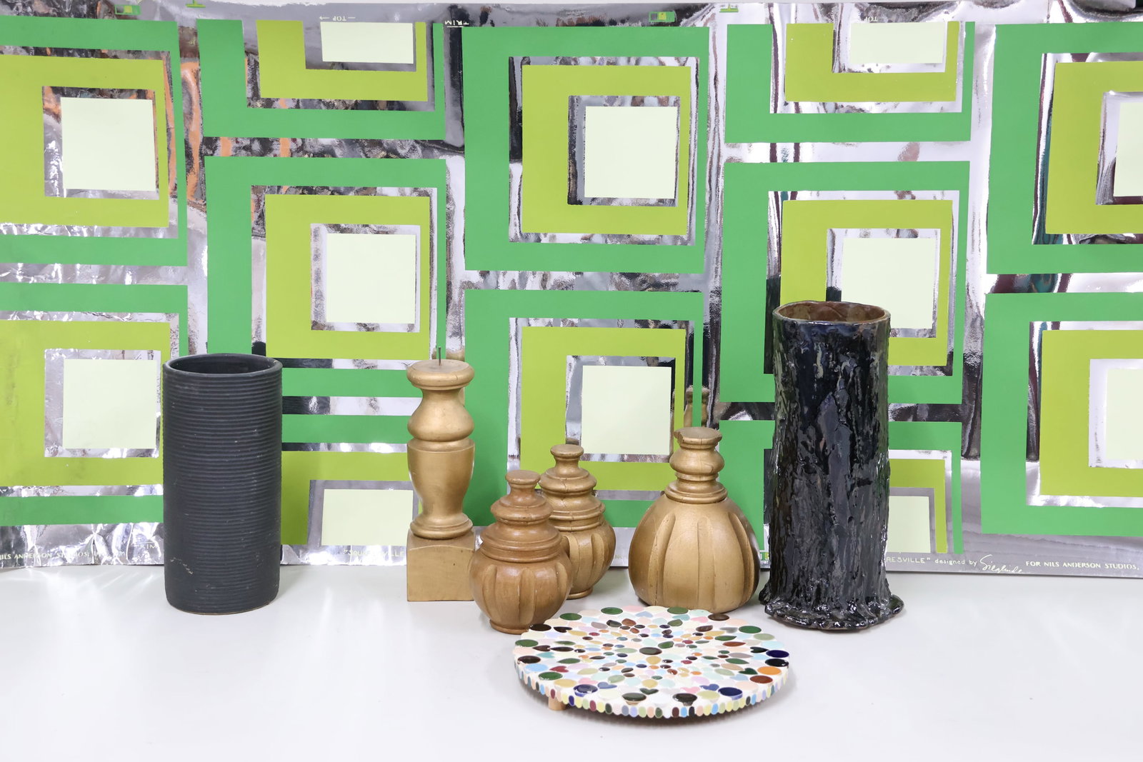 Vintage 1970's Mylar Wallpaper: Vintage 1970's Mylar Wallpaper Vintage 1970's Mylar Wallpaper, 30" wide roll featuring various shades of green and silver geometric shape marked "For Nils Anderson Studios Inc. 1970". Together with a