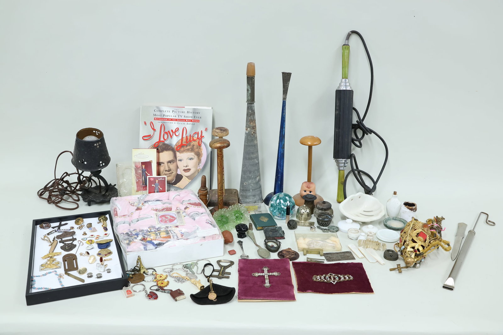 Group of Assorted Table and Desk Articles: Group of Assorted Table and Desk Articles Group of Assorted Table and Desk Articles. Including Monte Dunlavy glass paper weight, pocket knife, various key chains, cuff links, pair of green sandwich gl
