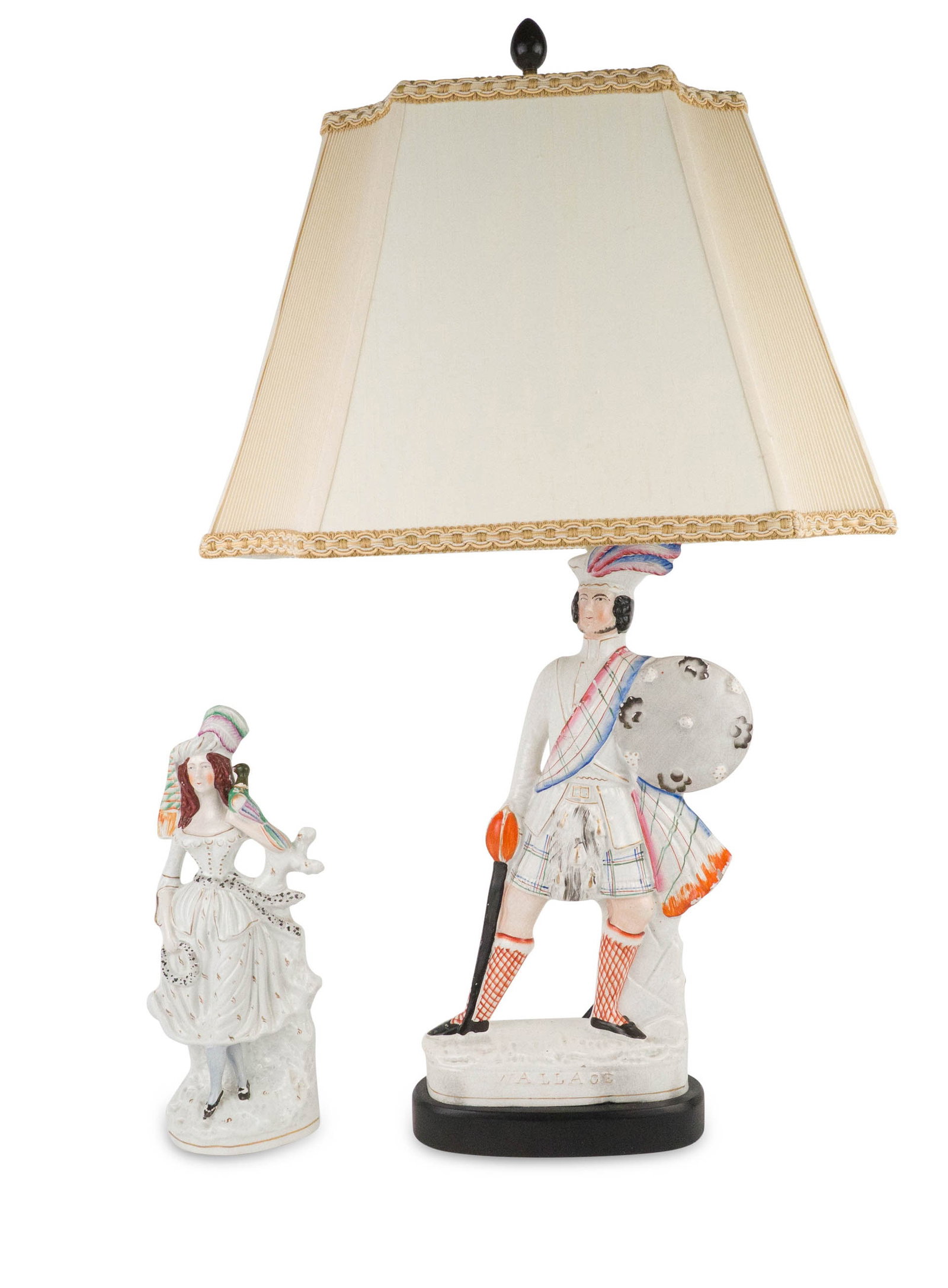 Two Staffordshire Pottery Figures: Two Staffordshire Pottery Figures Comprising, a figure of William Wallace, now fitted as a lamp, and one of a woman with a bird. 13 3/4 x 5 1/2 in. (34.9 x 14 cm.), and 34 x 9 1/2 x 4 1/2 in. (86.4 x