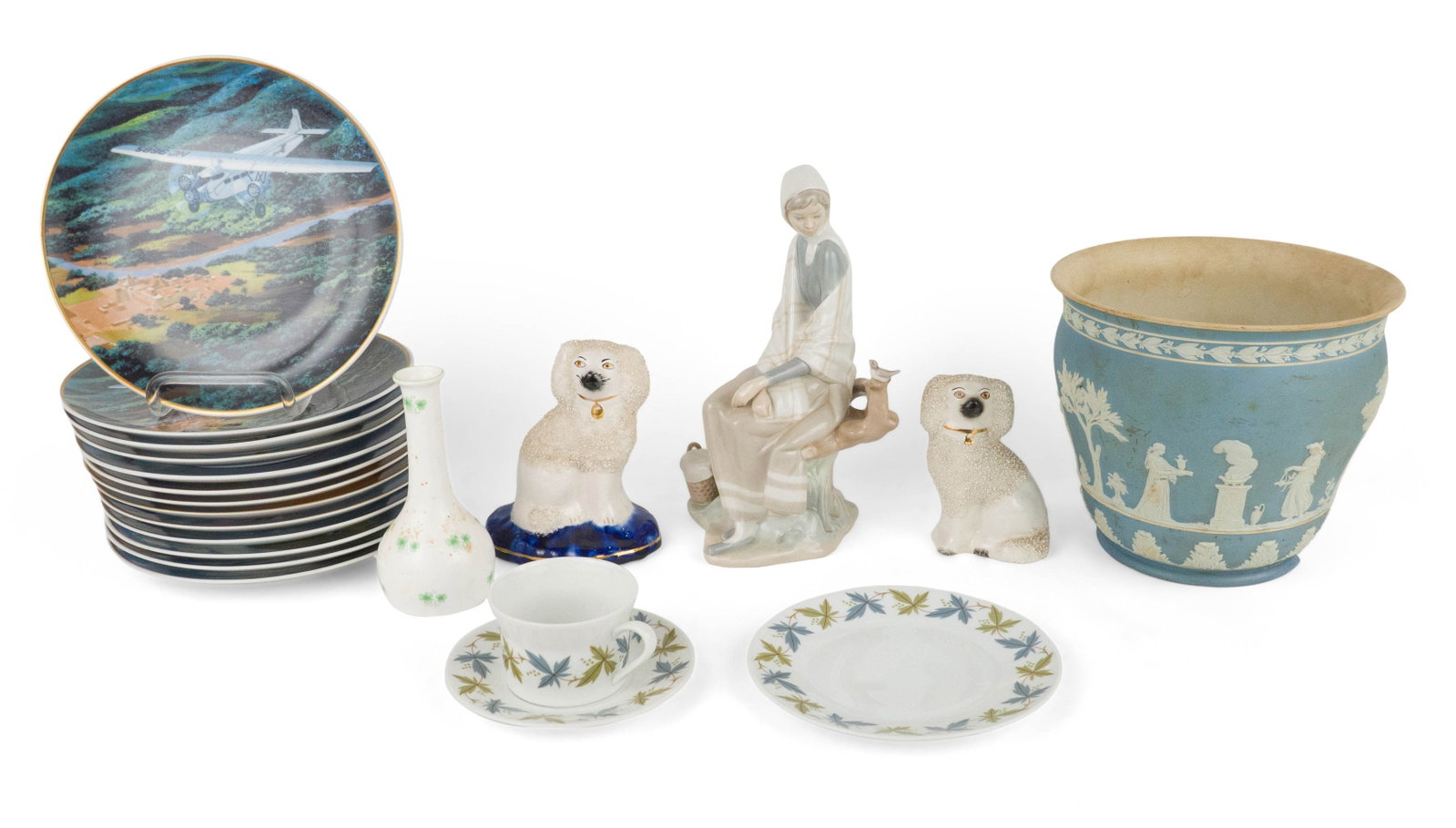 Two Staffordshire Confetti Coat White Poodles: Two Staffordshire Confetti Coat White Poodles English, 19th/20th C. Together with a Lladro "New Shepherdess" figure, a Staffordshire shamrock decorated bud vase, a Wedgwood jasperware planter, a Scher