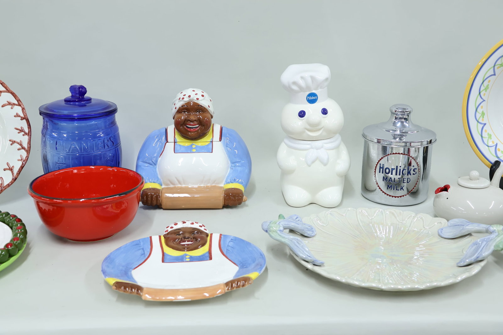 Group of Assorted Collectable Kitchen Articles: Group of Assorted Collectable Kitchen Articles Group of Assorted Collectable Kitchen Articles. Including Planters Peanut Blue Glass jar, Fitz and Floyd dragon fly tray, Les Fraises strawberry cake