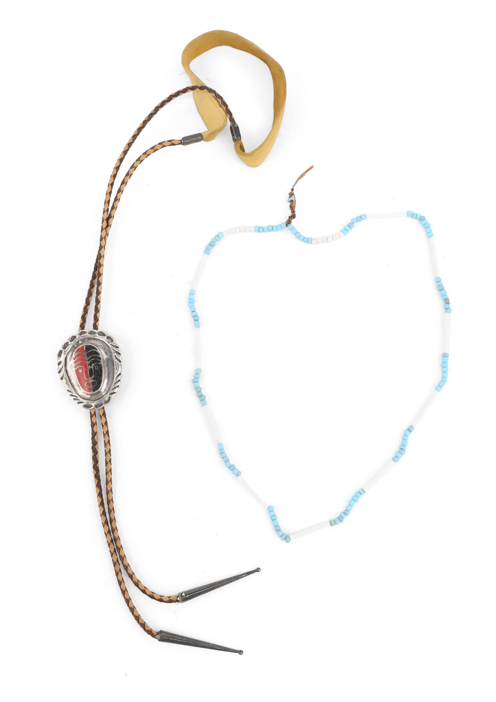 Native American Stone Inlaid Silver Bolo Tie: Native American Stone Inlaid Silver Bolo Tie Featuring a stylized split face mask inlay with leather braided cord, marked "TED" verso. Together with an Iroquois trade bead necklace with white glass wa