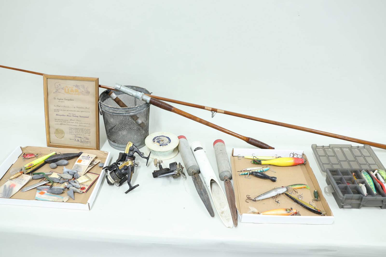 Vintage Group of Assorted Salt and Freshwater Fishing Articles: Vintage Group of Assorted Salt and Freshwater Fishing Articles Vintage Group of Assorted Salt and Freshwater Fishing Articles. Including wooden surf rod, lures, reels, sinkers and minnow basket. Used