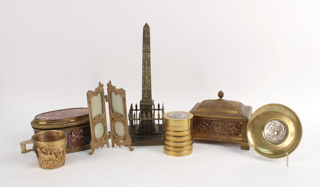 Gilt-Metal Specimen Marble Oval Jewelry Box: 19th/20th C. Together with a gilt-metal jewelry box, a miniature screen-form frame, a small dish, a covered jar, a gilt-metal cup, and a brass obelisk replica. Box: 3-1/2"h x 7"w x 4-1/2"d