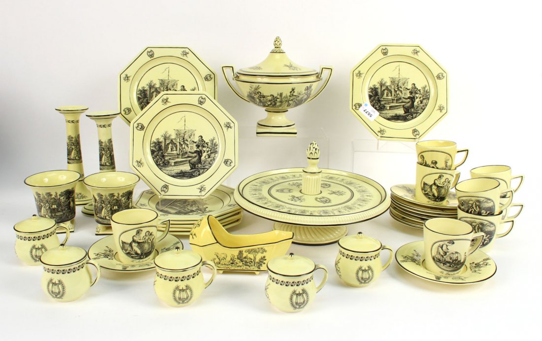 Mottahedeh Porcelain Partial Dinner Service: Black-and-Yellow Transferware, Italy, 20th C. With various stamps and markings. Comprising, eight octagonal plates, eight cups and nine saucers, five pot-de-creme, two cache pot, a covered tureen, a p