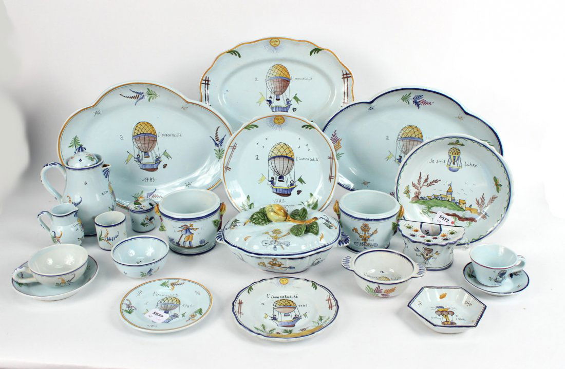Large Group of Quimper Faience Pottery Dinnerware: French, 20th C. Including, dinner plates, bread and butter plates, cache-pot, fruit bowls, creamers, cups, saucers, oval platters, pitcher, tureen, and small dishes. Apx. 101 pieces Largest platter: 1