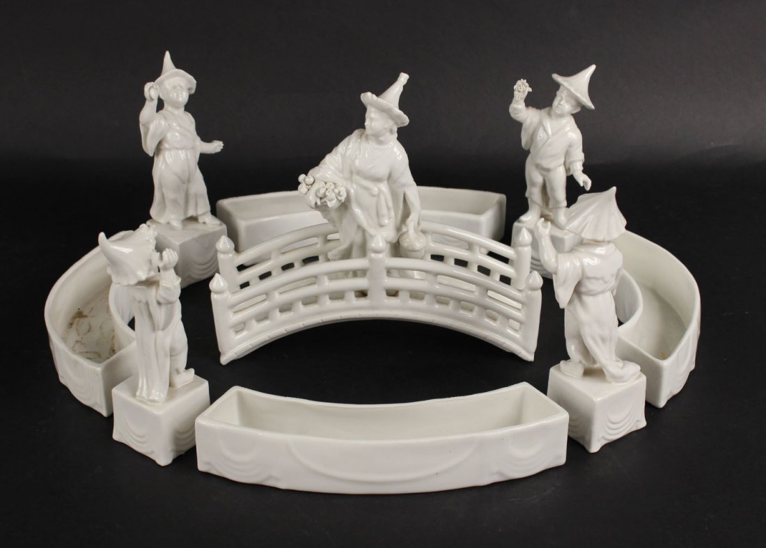 Mottahedeh Blanc de Chinese Figural Group: Italy, 20th C. Comprising, a figure on a bridge encircled by four figures and four dishes. Overall: 8-1/4"h x 16-1/2"w x 12"d