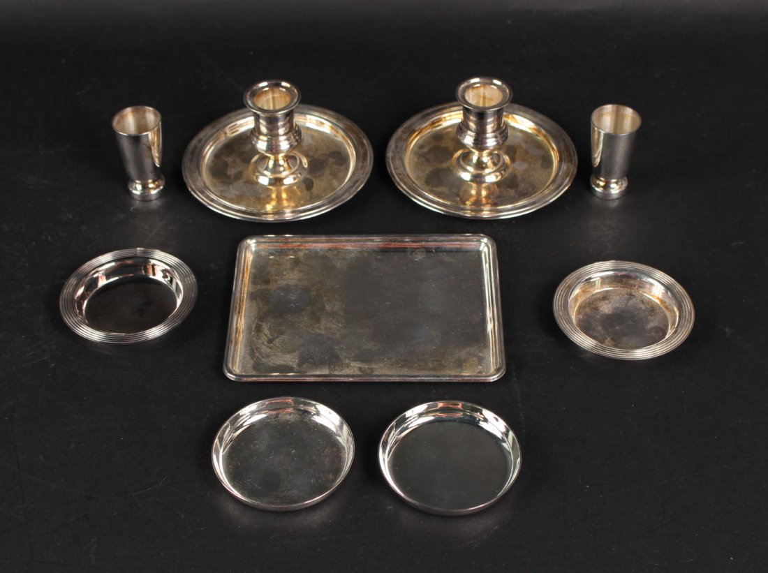 Pair of Christofle Silver Plated Candlesticks: 20th C. Together with a pair of Christofle cordial cups, and small circular dishes, together with a silver plated small rectangular tray and two small dishes. Candlesticks, 2-1/2"h x circular base 4-7