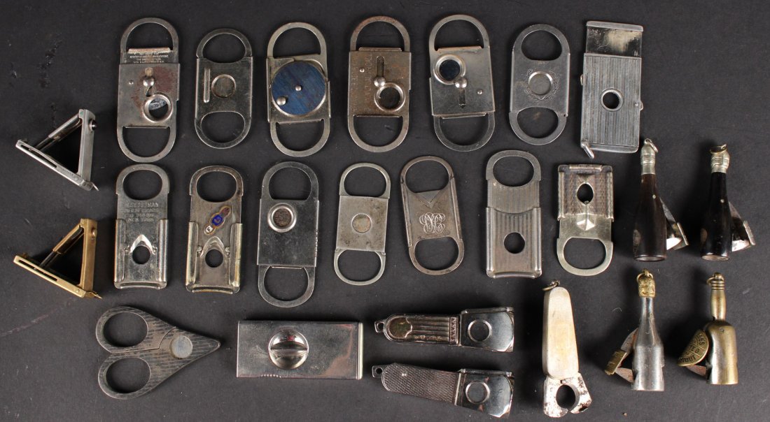 Twenty-Five Gold and Silver Tone Cigar Cutters: Some marked. 2-1/2