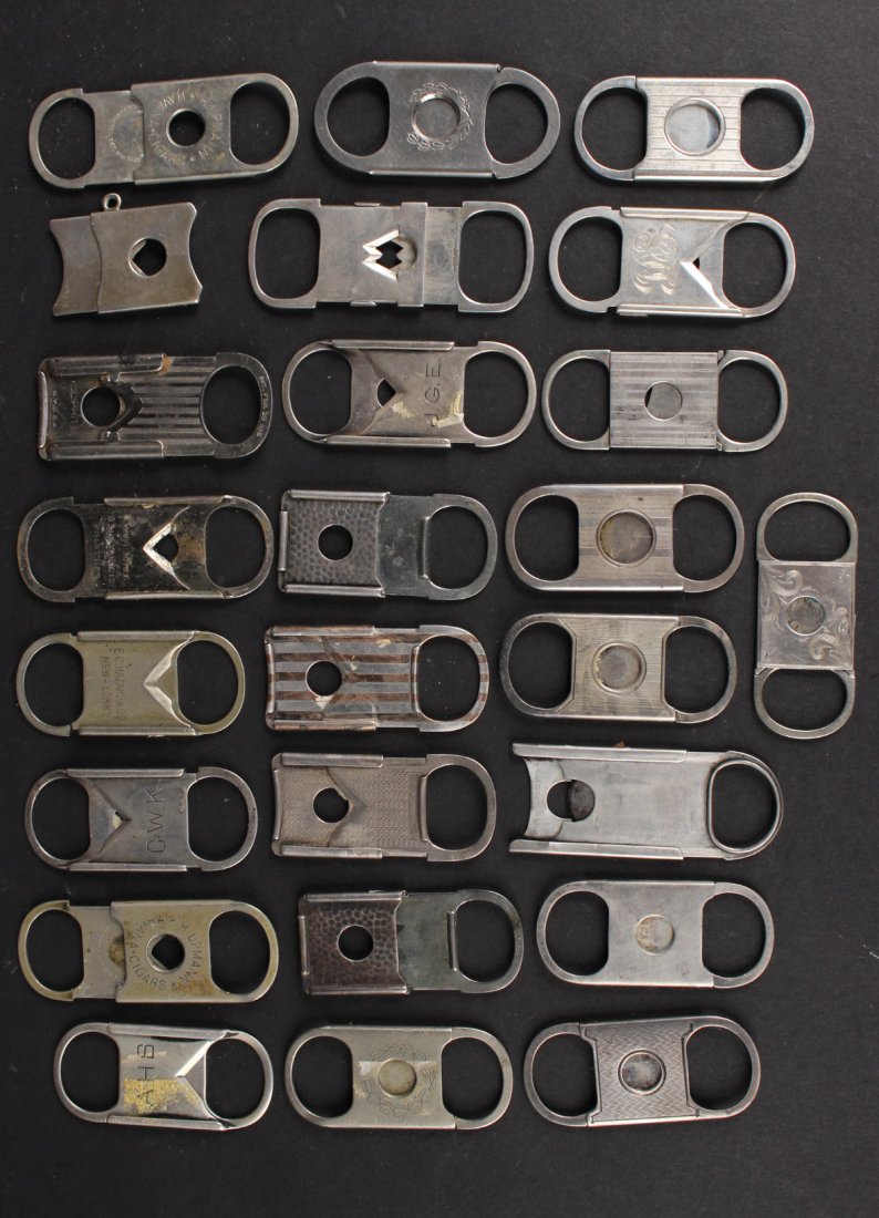 Twenty-Five Silver Metal Cigar Cutters: Some marked with maker's marks, seven Sterling. Largest: 2-3/4"l