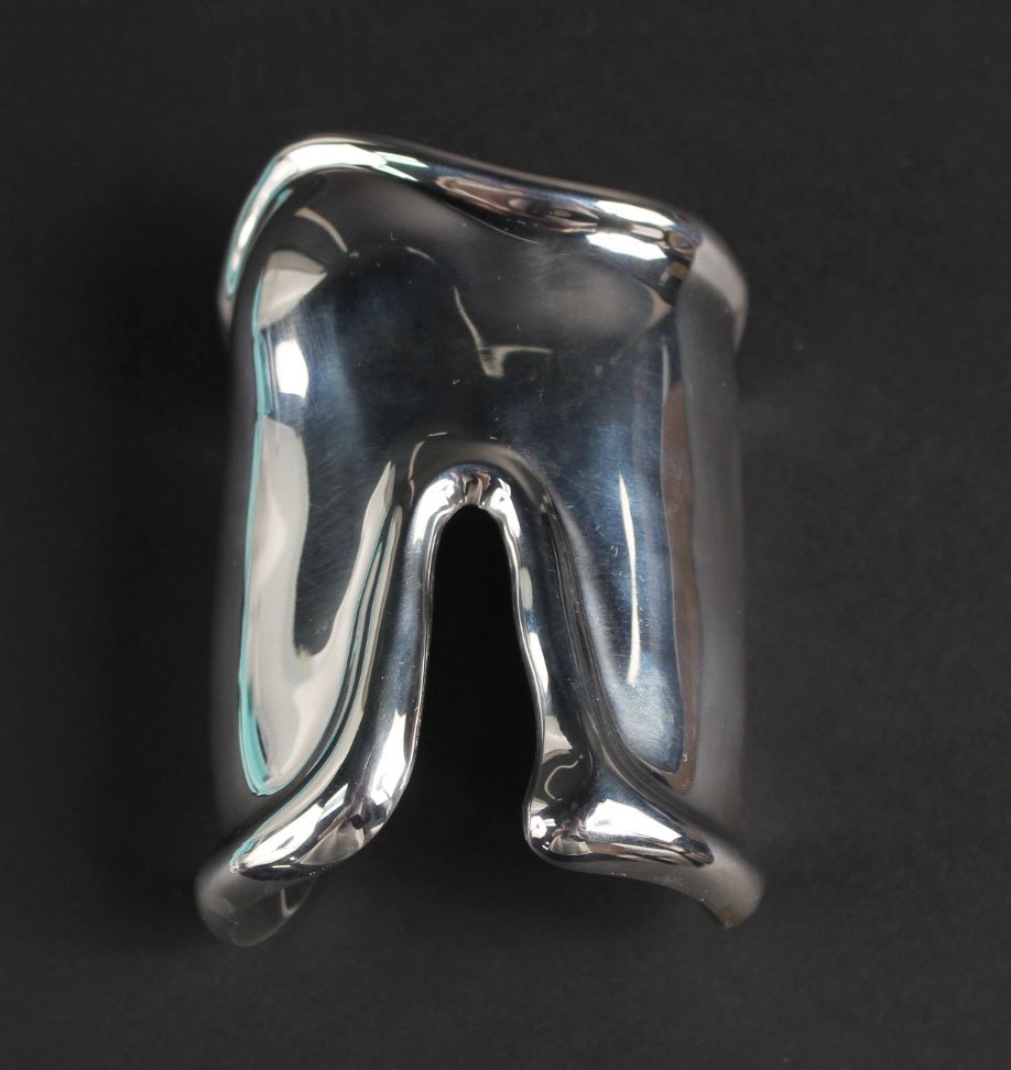 Elsa Peretti, Tiffany Sterling Silver "Bone" Cuff: Stamped "Peretti Tiffany & Co. Italy 1975 Sterling 925", weighing approx. 86.60dwts. 3-3/4"l