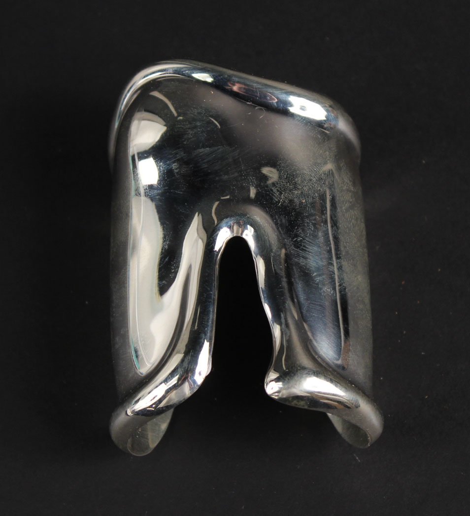 Elsa Peretti, Tiffany Sterling Silver "Bone" Cuff: Stamped "Peretti Tiffany & Co. Italy 1975 Sterling 925", weighing approx. 86.60dwts. 3-3/4"l