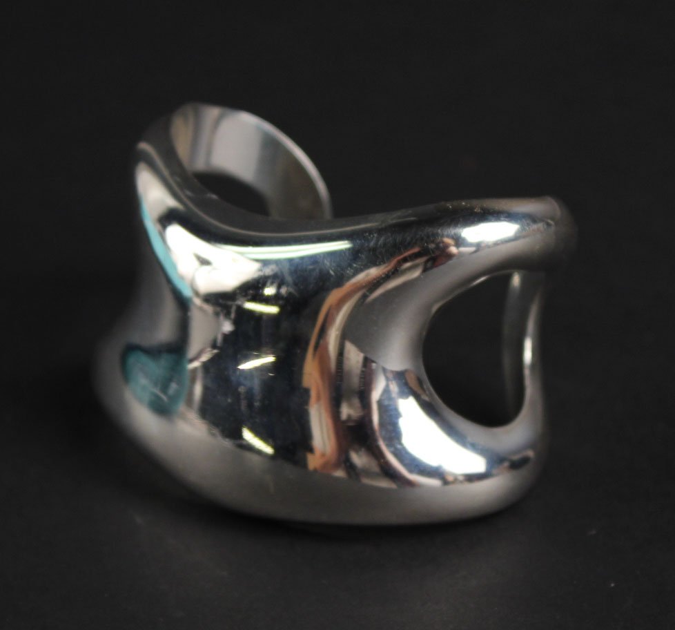 Elsa Peretti, Tiffany Sterling Silver "Bone" Cuff: Stamped "Peretti Tiffany & Co. Italy 1975 Sterling 925", weighing approx. 39.50dwts. 3-3/4"l