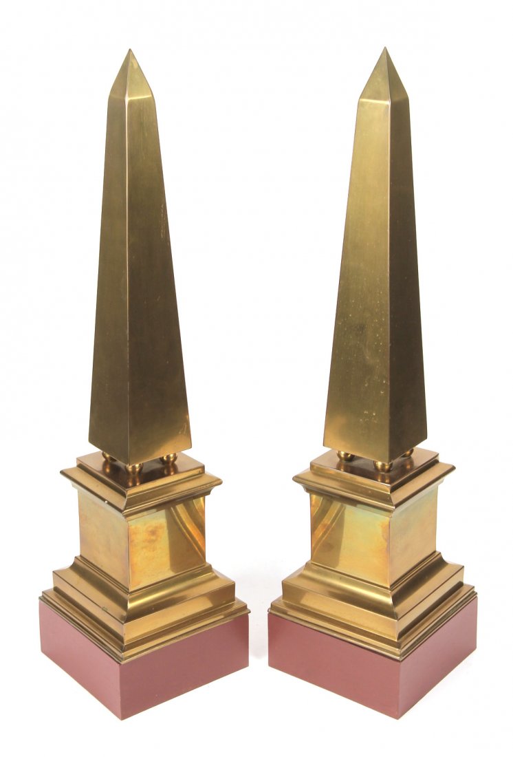 Pair of Brass Obelisks: On painted wood stands. 24-1/2"h x 6"sq.