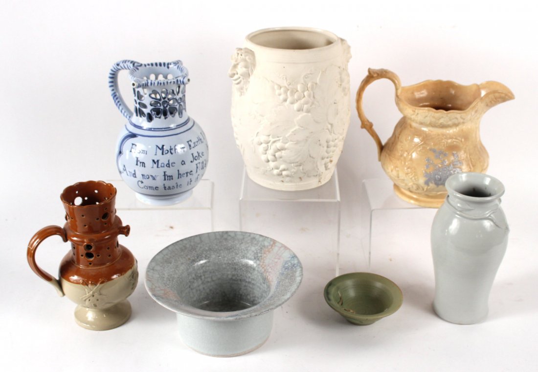 Seven Pottery Articles: Including jugs, vases and a wine cooler. Tallest 9"h