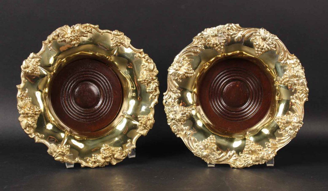 Pair of Gilt Silver Plated Large Wine Coaster: Grape & leaf motif, with wood bases. Each 9"d