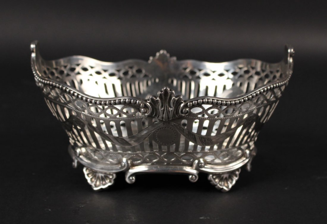 English Silver Oval Footed Basket: Hallmarked Charles Stuart Harris, London, 1895, with shell decoration, reticulated sides, vacant cartouche, weight approx. 5 T.O. 3"h x 6"l