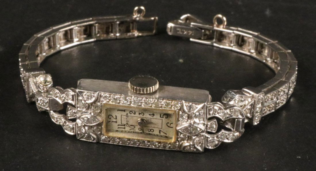 White Gold and Diamond Bracelet Wristwatch: Rectangular face stamped Croton, containing two bezel set marquise diamonds, each weighing approx. .05carats, approx. 30 small bead set diamonds, band containing approx. 72 small bead set diamonds, gr