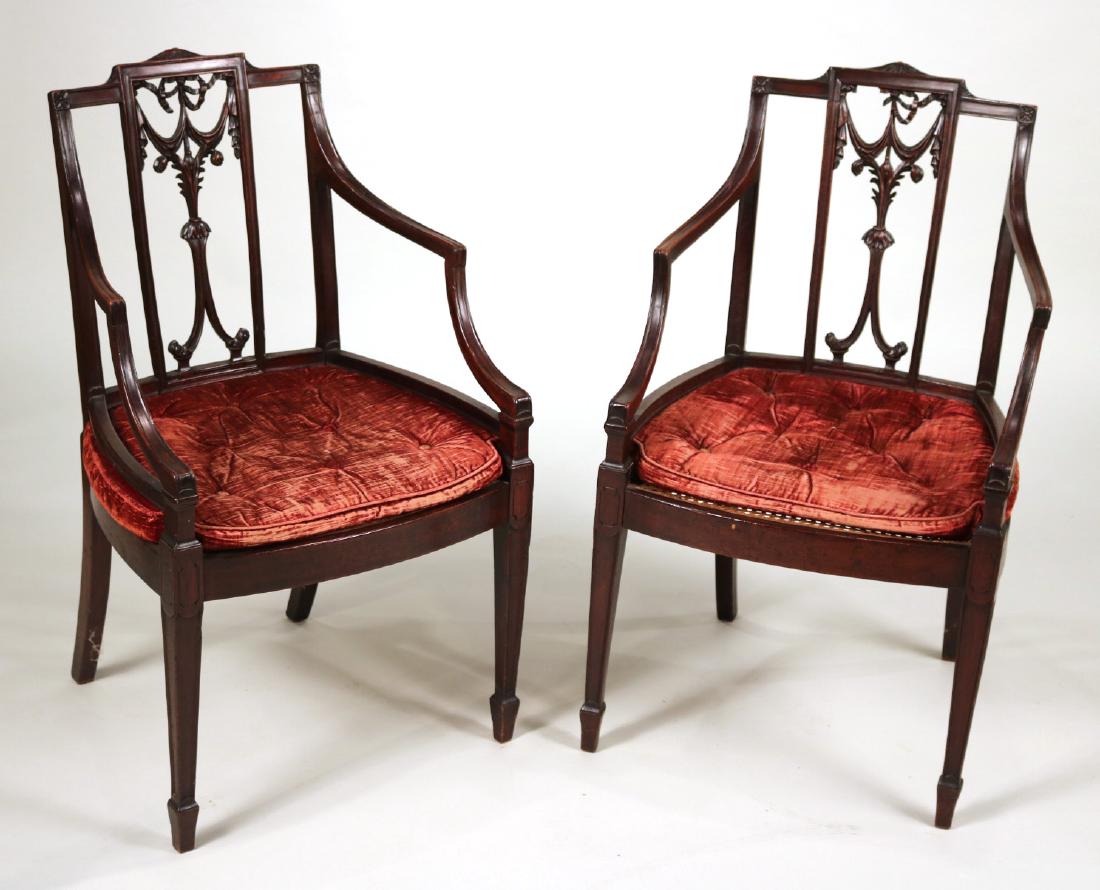 Pair of Federal Carved Mahogany Armchairs: New York or Philadelphia, c. 1795, with caned seats. 36-1/2"h x 21"w x 20"d