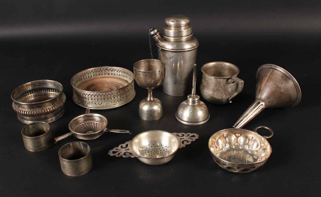 Group Sterling Silver Bar Items: Including two Tiffany & Co funnels, a Black Starr Frost & Gorham cocktail shaker, a double jigger, monogrammed, together with a sterling silver tea strainer and childs' cup, total weight approx. 14 T.