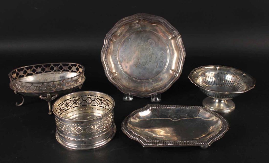 Five German 800 Silver Table Items: Comprising a wine coaster, footed bonbon dish, footed oval bowl, circular dish with shaped border and footed oblong dish, total weight approx. 17 T.O. Wine coaster 4"d