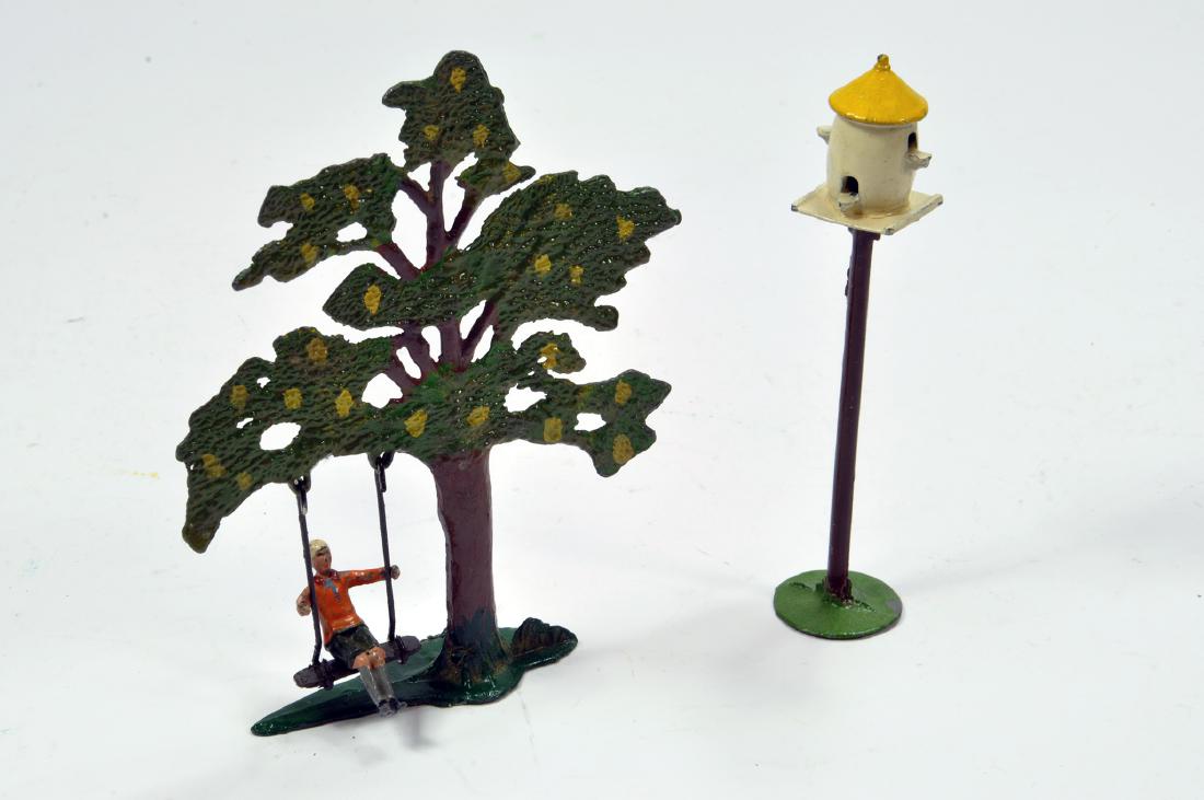 A John Hill Co Metal Tree And Swing With Boy Figure