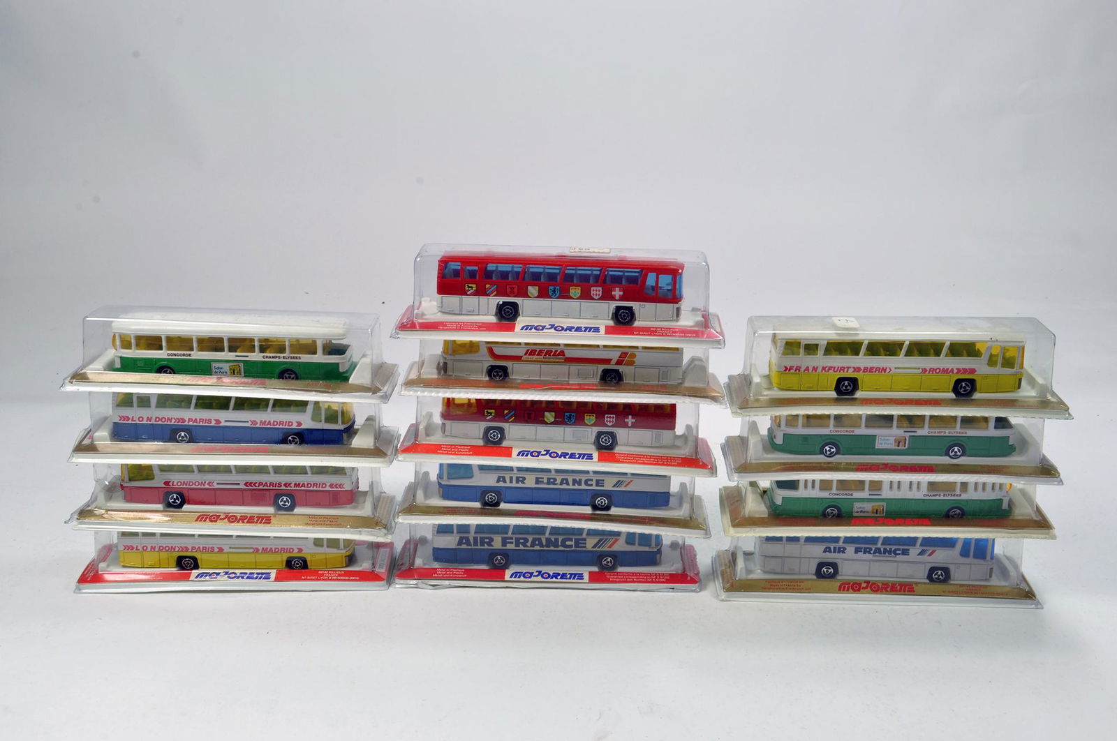 A large group of Majorette diecast bus coach issues: A large group of Majorette diecast bus coach issues with various liveries. NM. (13)