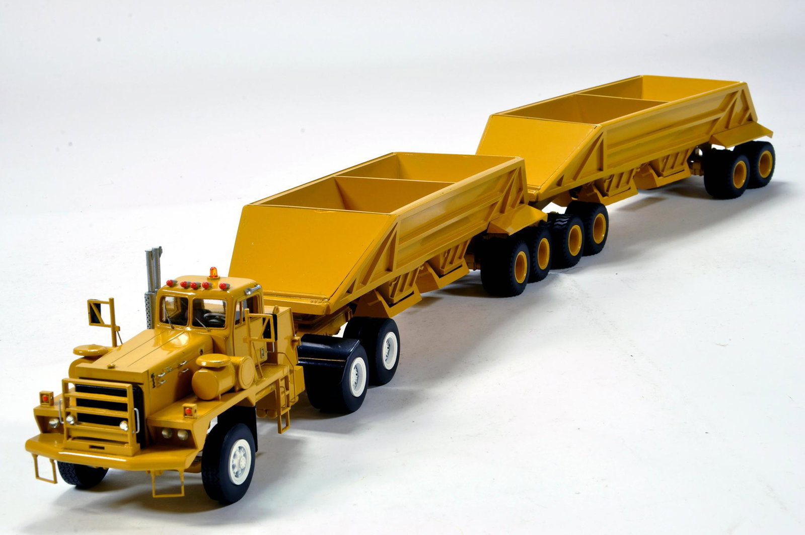 Dan Models 1/50 Combination Model of a Uranium Mine PLZ: Dan Models 1/50 Combination Model of a Uranium Mine PLZ Tractor Unit with Tandem King Bottom Dump Trailer with connecting dolly. Superbly detailed and rare piece.
